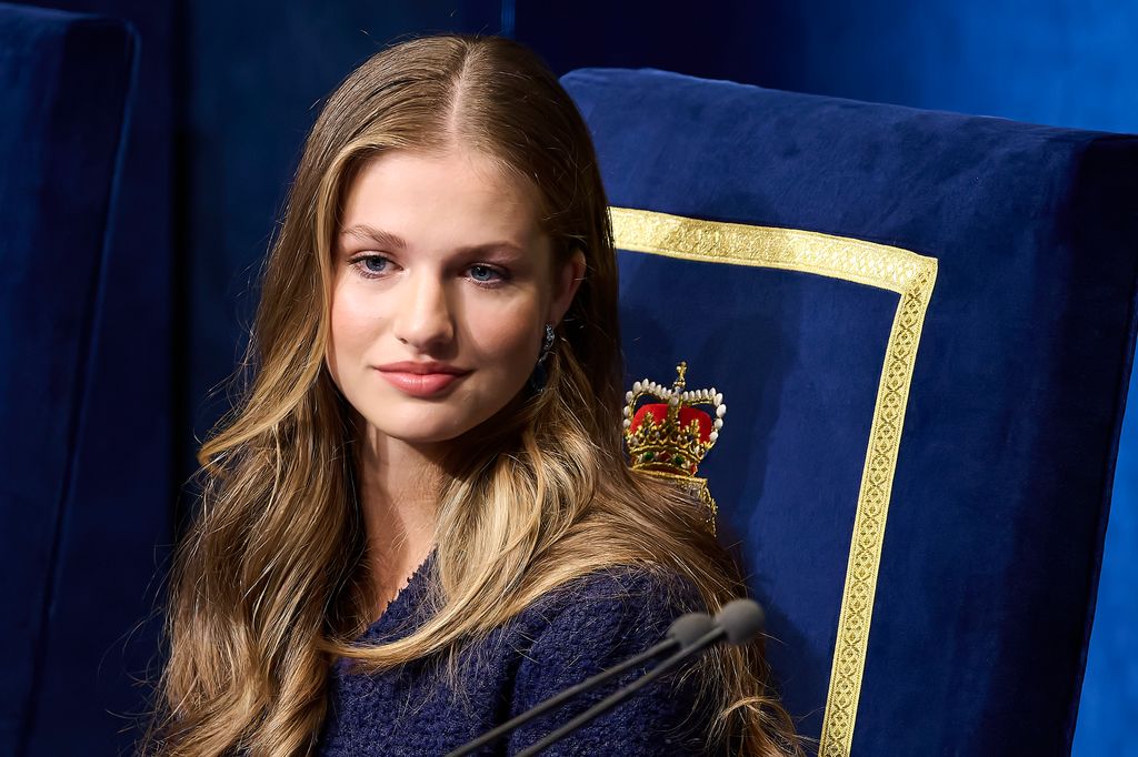 Princess Leonor in a blue outfit on a blue chair