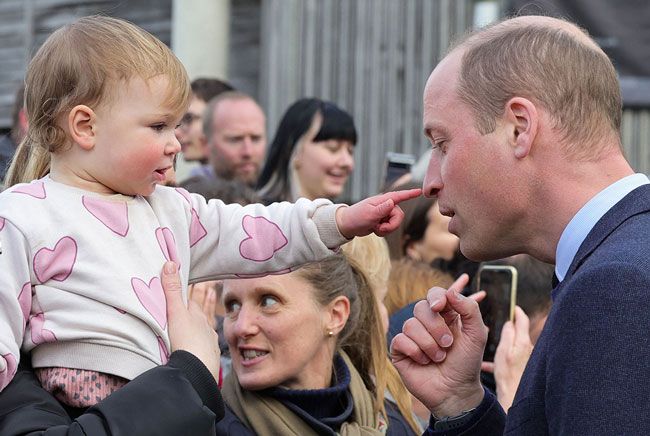 Toddler points at Prince Williams nose