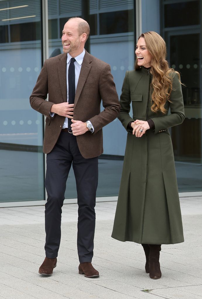 Prince William and Kate Middleton laughing together during a trip to Northern Ireland
