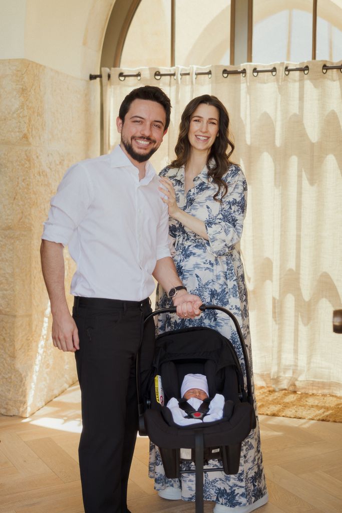 Jordan's Crown Prince Hussein (or Al Hussain), holds his newborn daughter Princess Iman, with his wife, Princess Rajwa, as they leave the King Hussein Medical Centre hospital, in Amman, 