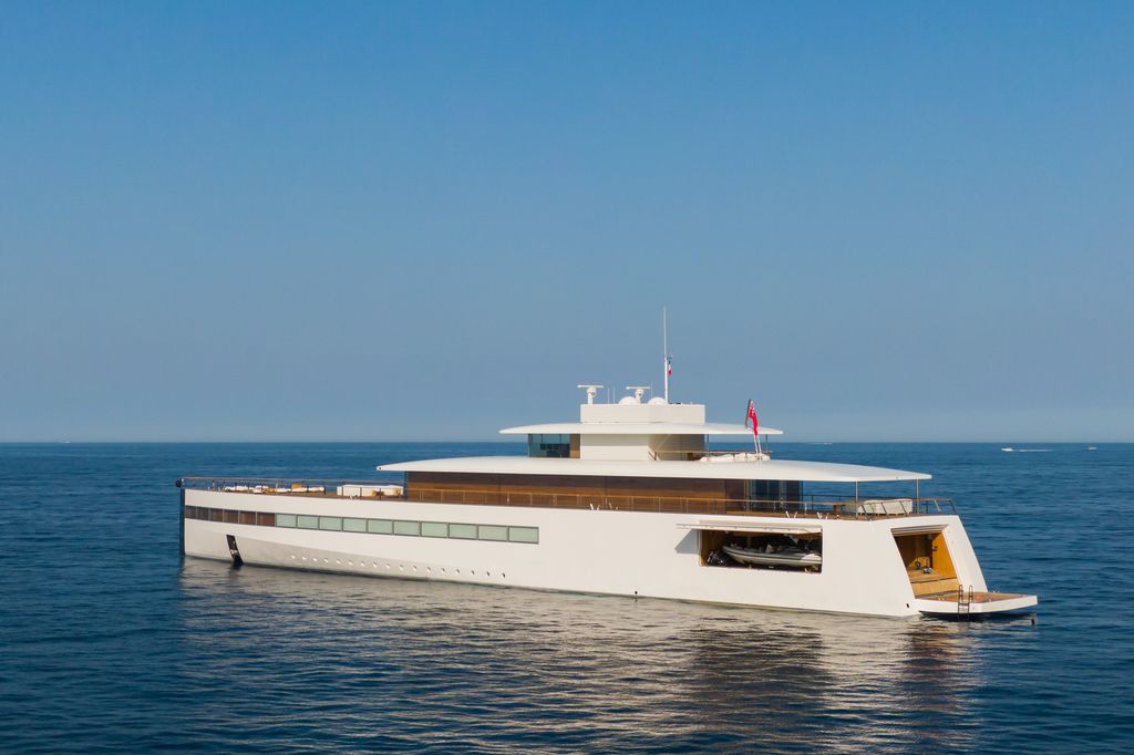 wide shot of venus superyacht with blue sky in background