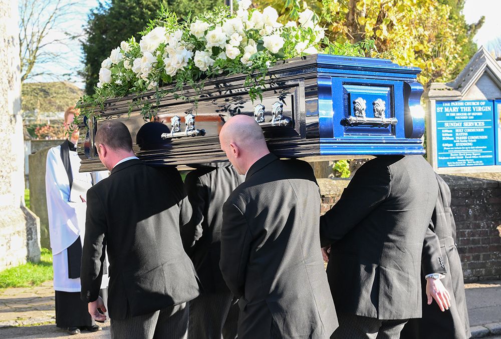 Pallbearers carry the coffin of Liam Payne