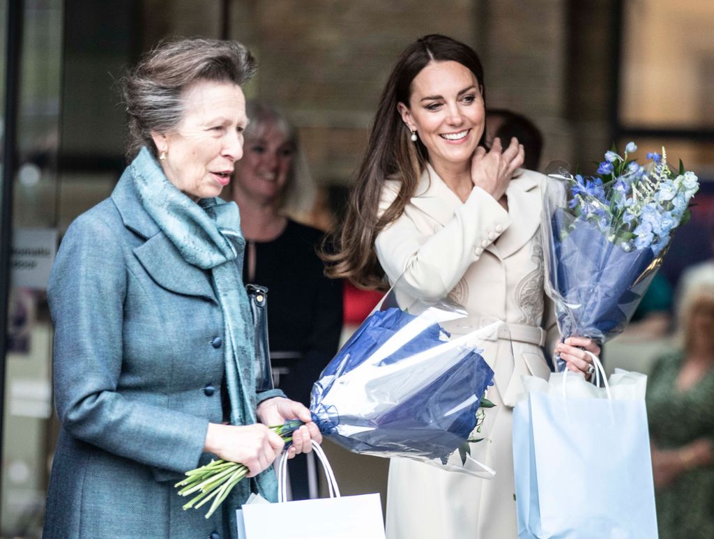 Princess Anne and Princess Kate receive flowers as they leave the RCM and RCOGs headquarters on April 27, 2022 