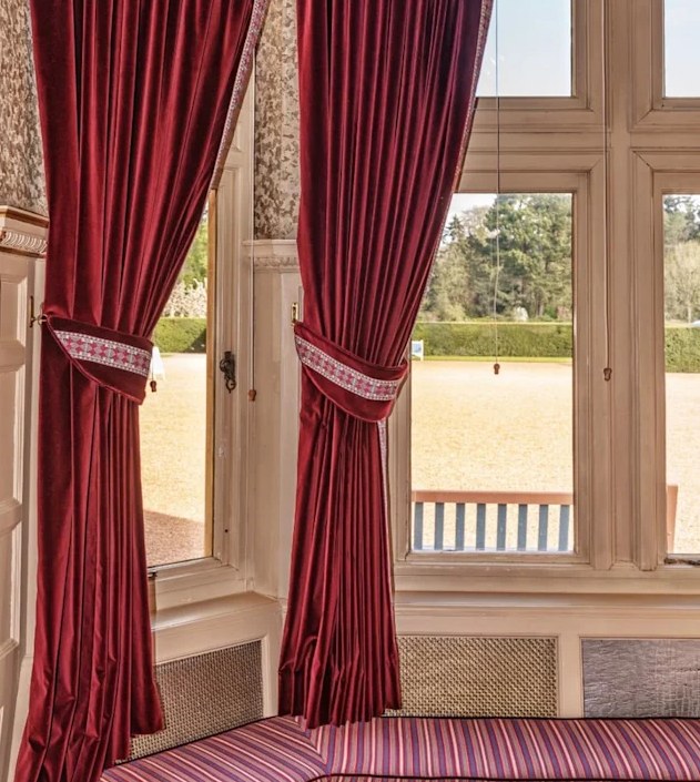 red curtains by window