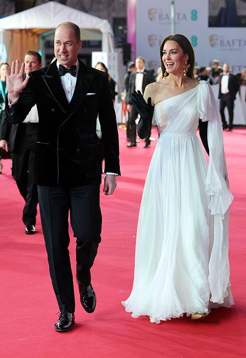 Prince and Princess of Wales wave on BAFTA red carpet
