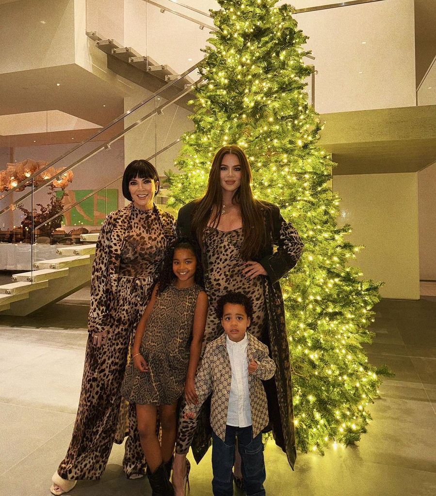 Khloé Kardashian and her children True and Tatum, plus Kris Jenner, pose in front of the former's Christmas tree during their Thanksgiving dinner, shared on Instagram