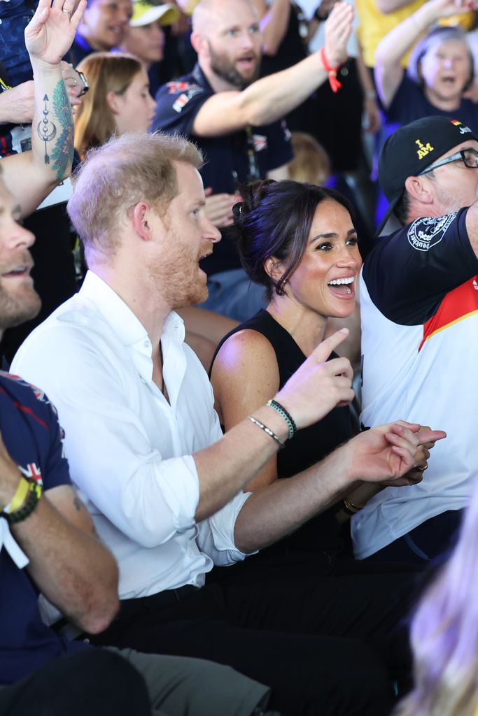 Harry and Meghan singing and dancing