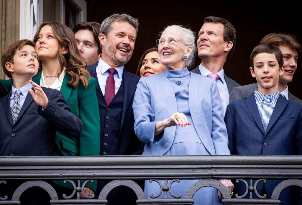 Queen Margrethe standing with Crown Prince Frederik, Prince Joachim and younger members of the Danish royal family