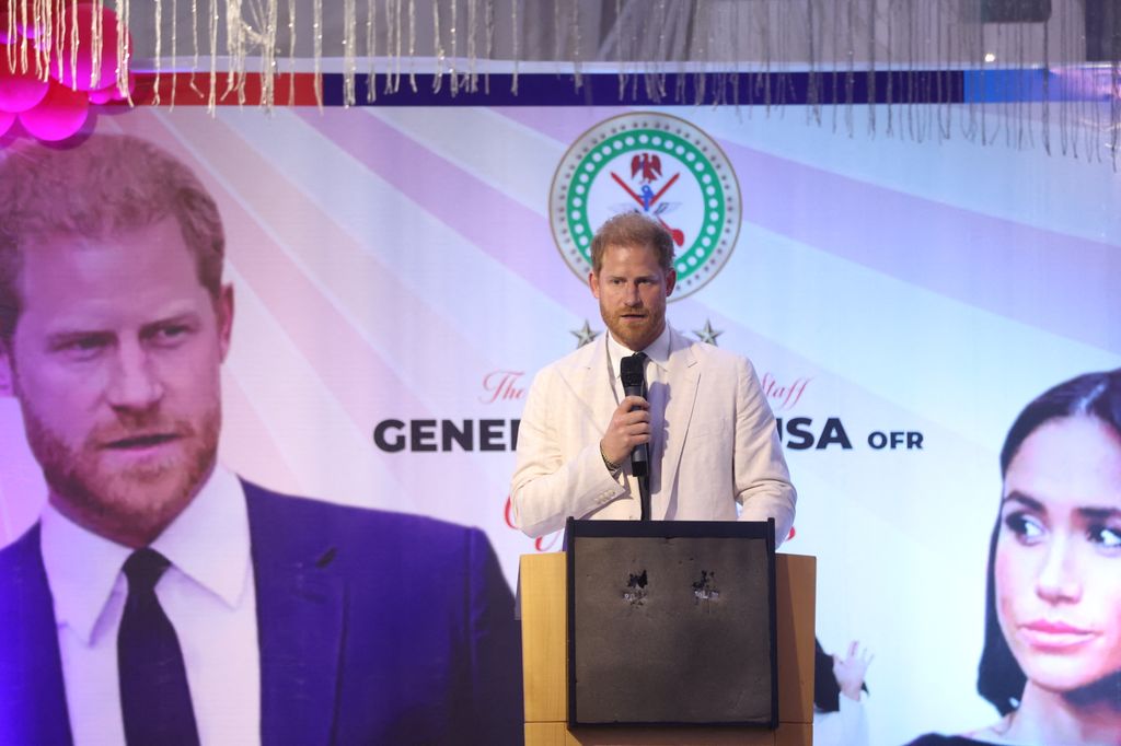 Prince Harry gives a speech as he attends a Sit Out lunch at the Nigerian Defence Headquarters in Abuja