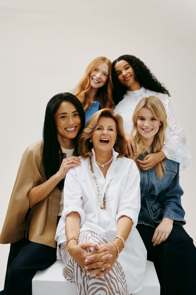 susan powls surrounded by models with hair styled