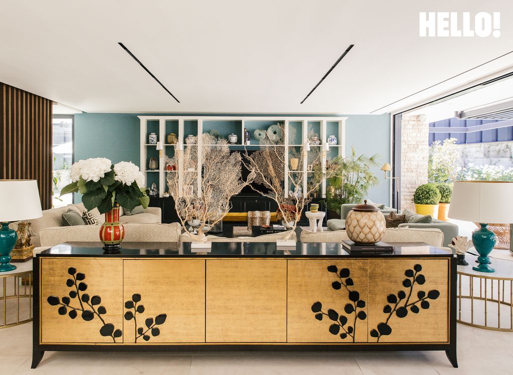 The decor includes personal touches such as coral branches in one of the living rooms inside their three-storey, contemporary-style house