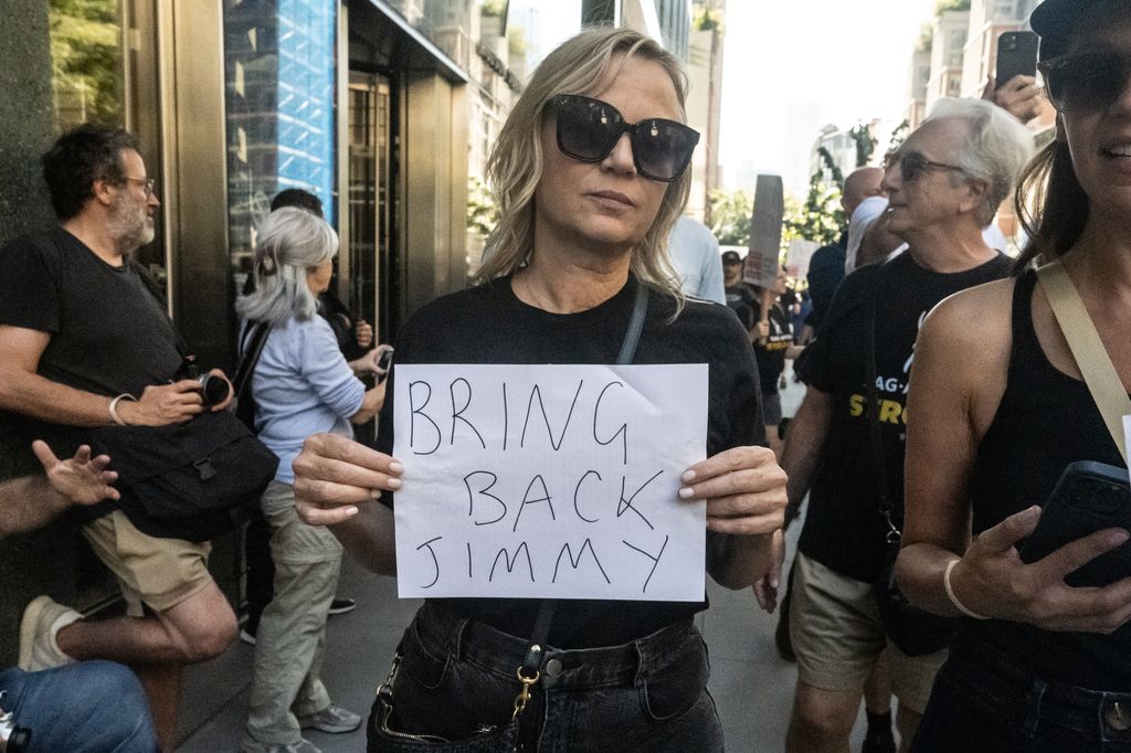 People participate in a protest, organized by the Writers Guild of America East, against ABC's decision to suspend Jimmy Kimmel from his late night show on September 19, 2025 in New York City.