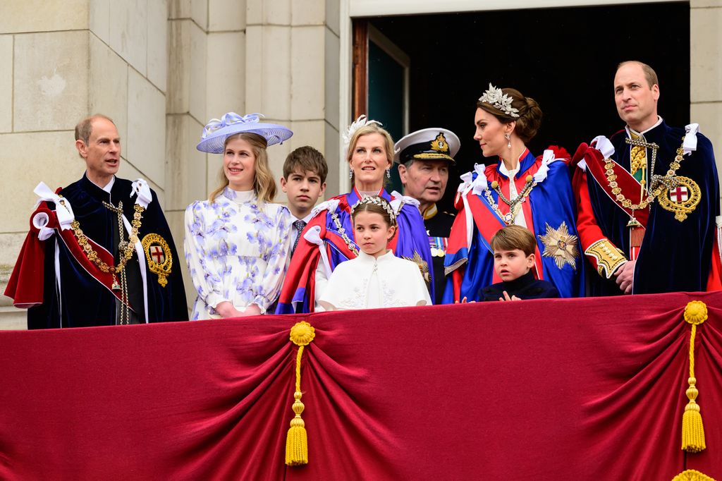 royal family standing on royal balcony 