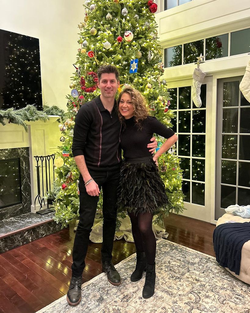 Ginger Zee and Ben Aaron pose in front of their Christmas tree in the family home