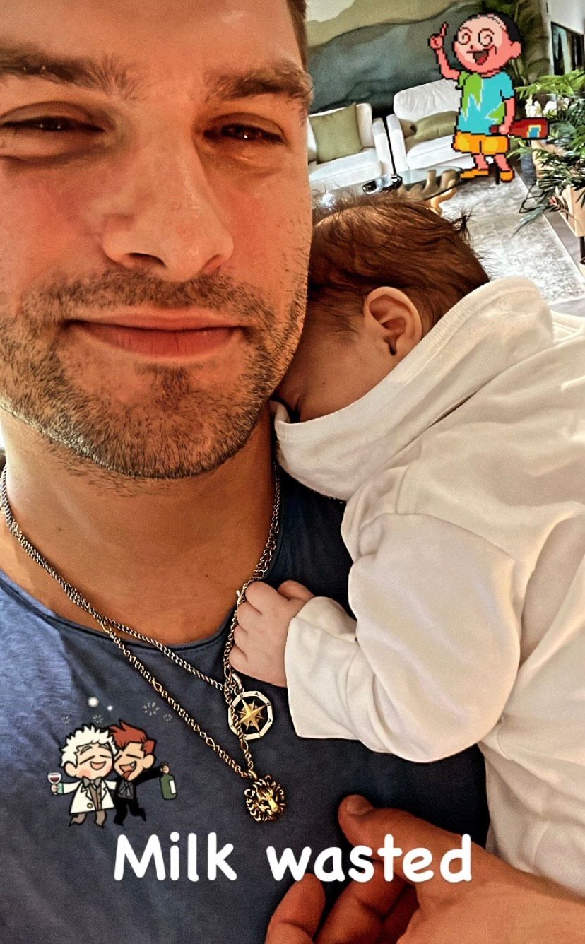 Proud dad Aljaz cuddling a milk-drunk baby Lyra