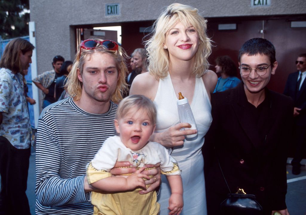 Kurt Cobain of Nirvana (right) with wife Courtney Love and daughter Frances Bean Cobain, and Sinead O'Connor at the 10th Annual MTV Video Music Awards in 1993