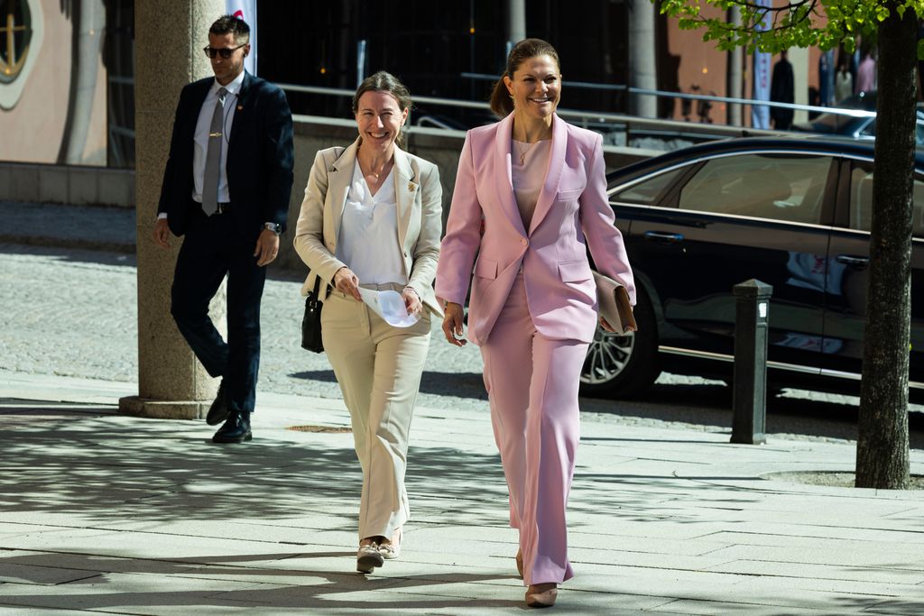 Crown Princess Victoria walking in pink suit