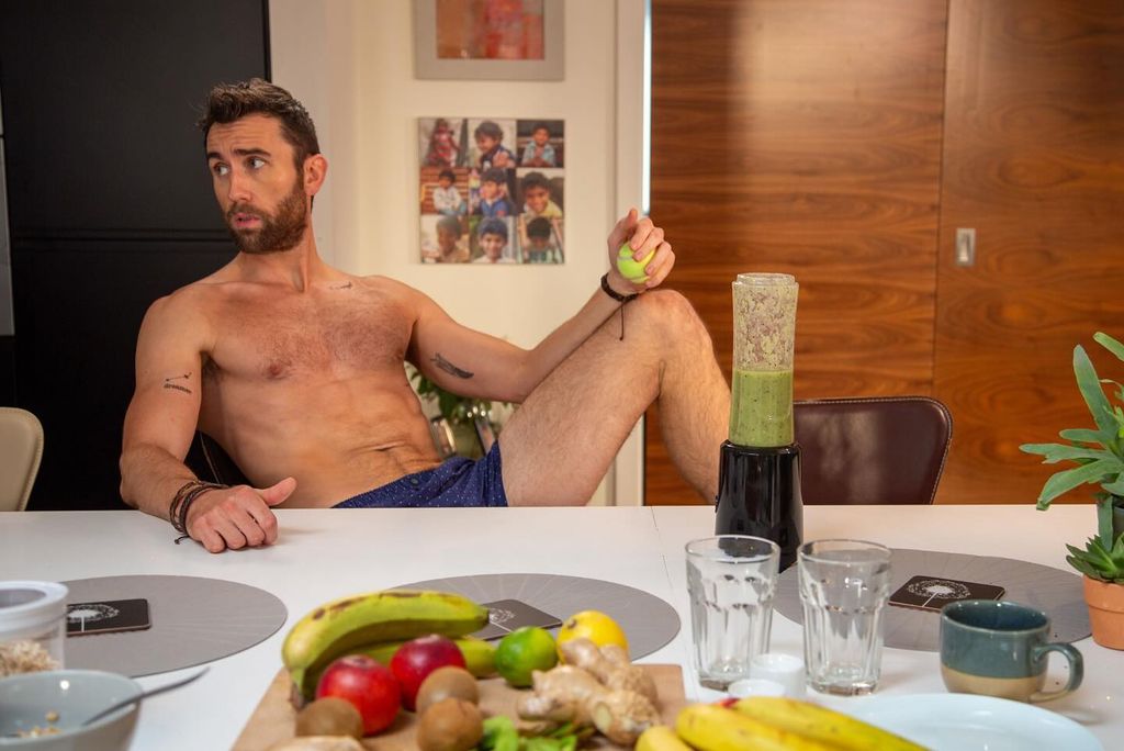 Matthew topless at dining table