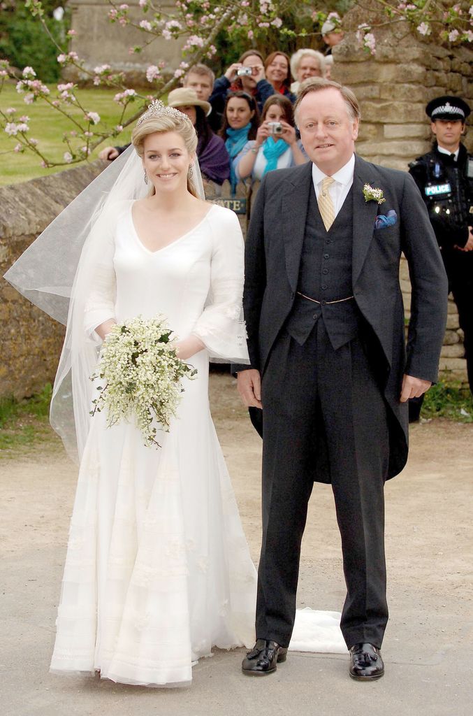 Laura Lopes in a bridal dress and Andrew Parker Bowles in a grey suit