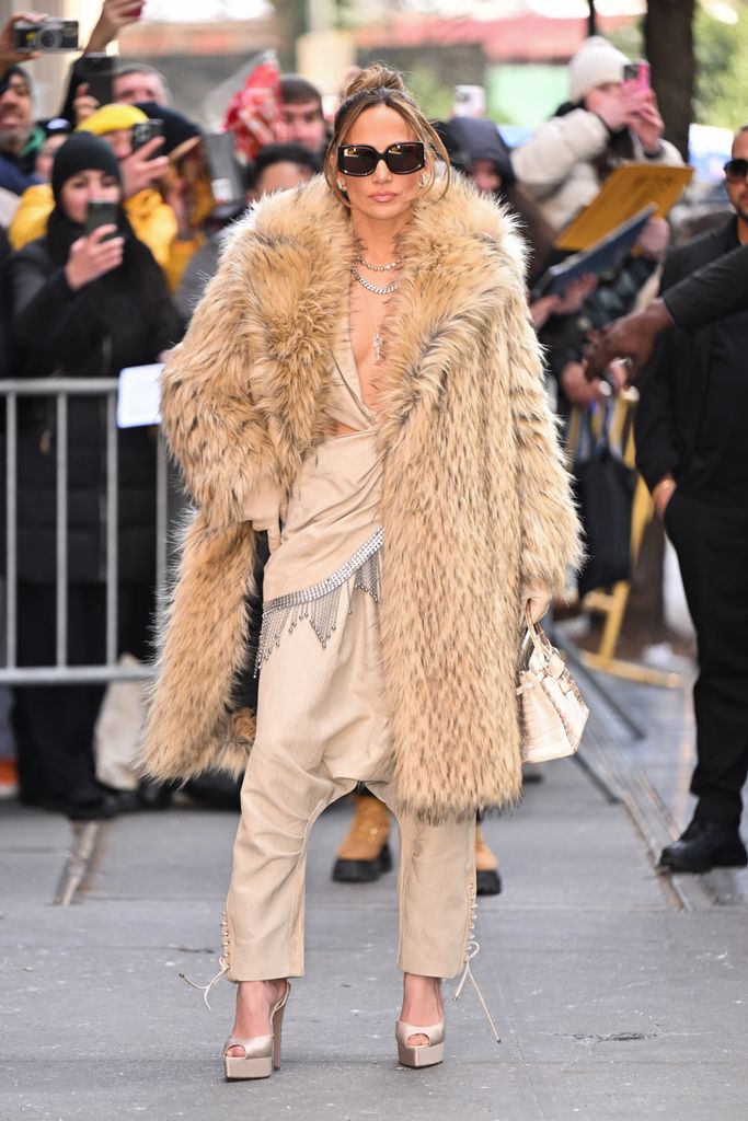 Jennifer Lopez in beige fur coat and jumpsuit