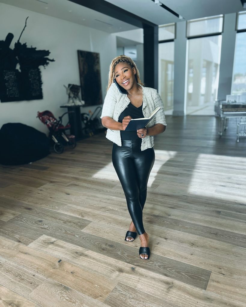 Serena smiling in leather pants
