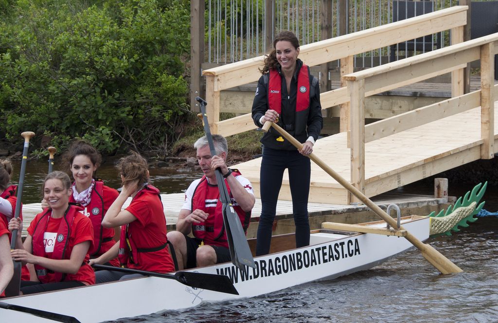 The Duchess Of Cambridge rows in a Dragon Boat in Canada against Prince William