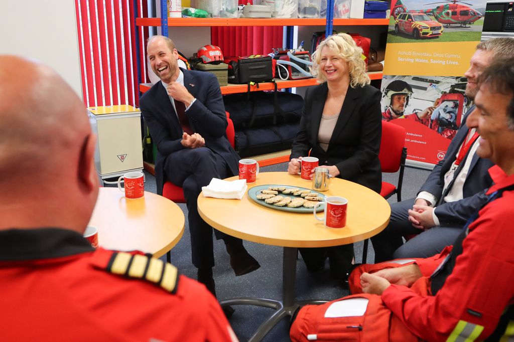 Prince William meets with staff and crew members as he visits the Wales Air Ambulance