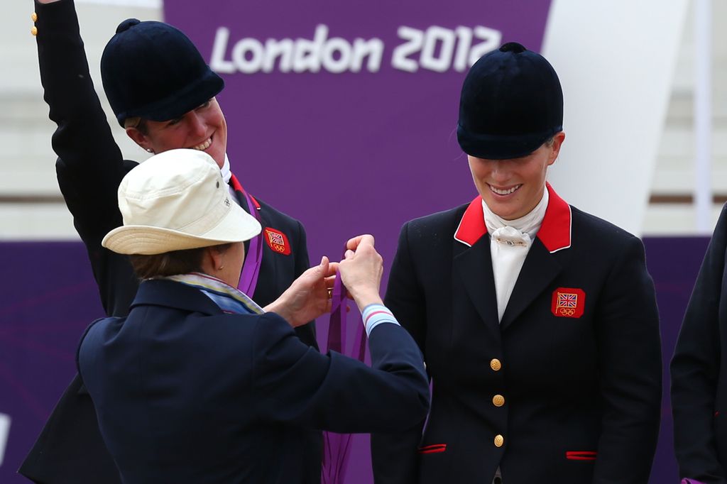 Zara Phillips is presented a silver medal by her mother, Princess Anne, Princess Royal after the Eventing Team Jumping Final Equestrian event on Day 4 of the London 2012 Olympic Games