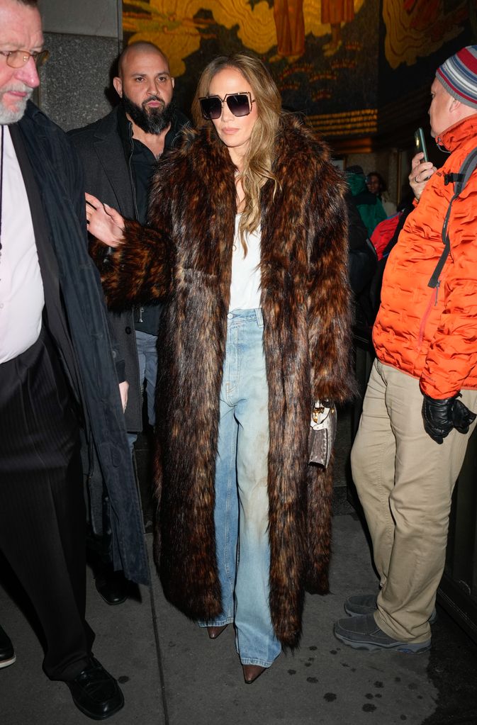 JLo in long brown fur coat and sunglasses