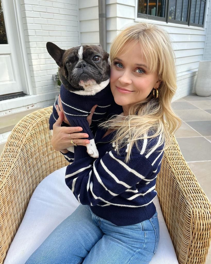 Reese Witherspoon twinning with her dog Minnie Pearl in striped sweater