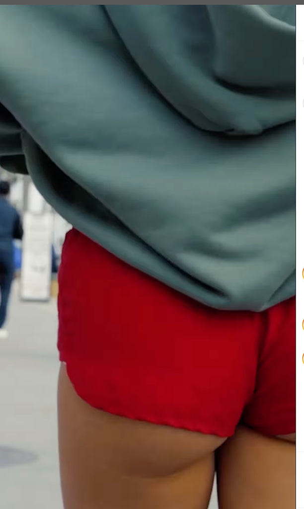 Rita Ora walks away from the camera in a tiny pair of red hotpants