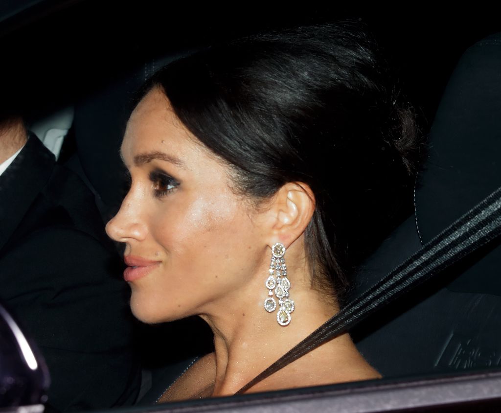 Meghan and Harry arriving at Prince Charles's 70th birthday in 2018