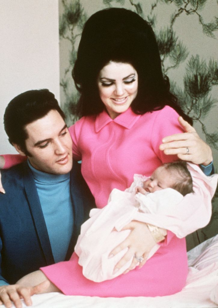 Priscilla and Elvis with their new daughter, Lisa Marie, in Memphis, Tennessee, 5 February 1968.