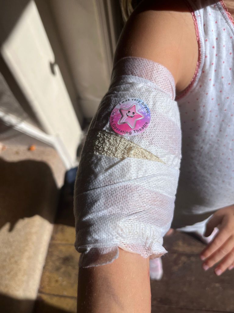 Darcey's bandaged arm