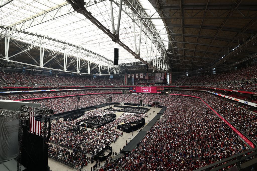 People attend the public memorial service for right-wing activist Charlie Kirk at State Farm Stadium in Glendale, Arizona, on September 21, 2025