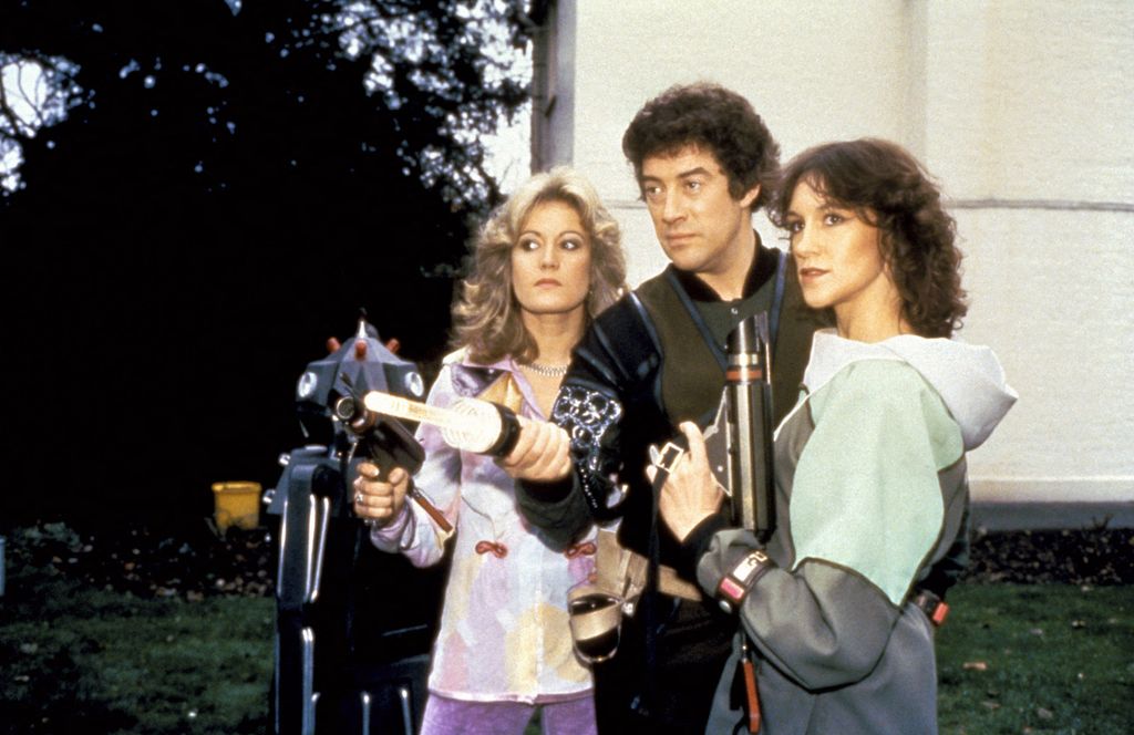Sally Knyvette, Gareth Thomas and Jan Chappell posing with laser guns in Blake's 7