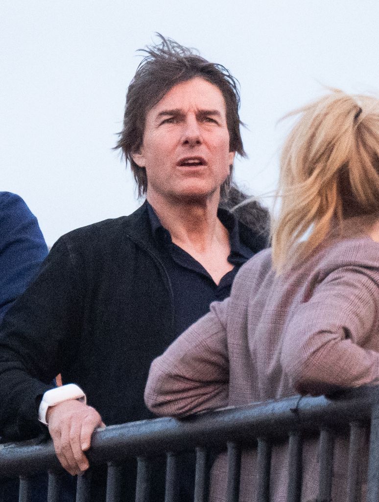 Tom Cruise looks on ahead of Coldplay performing during day four of Glastonbury Festival 2024