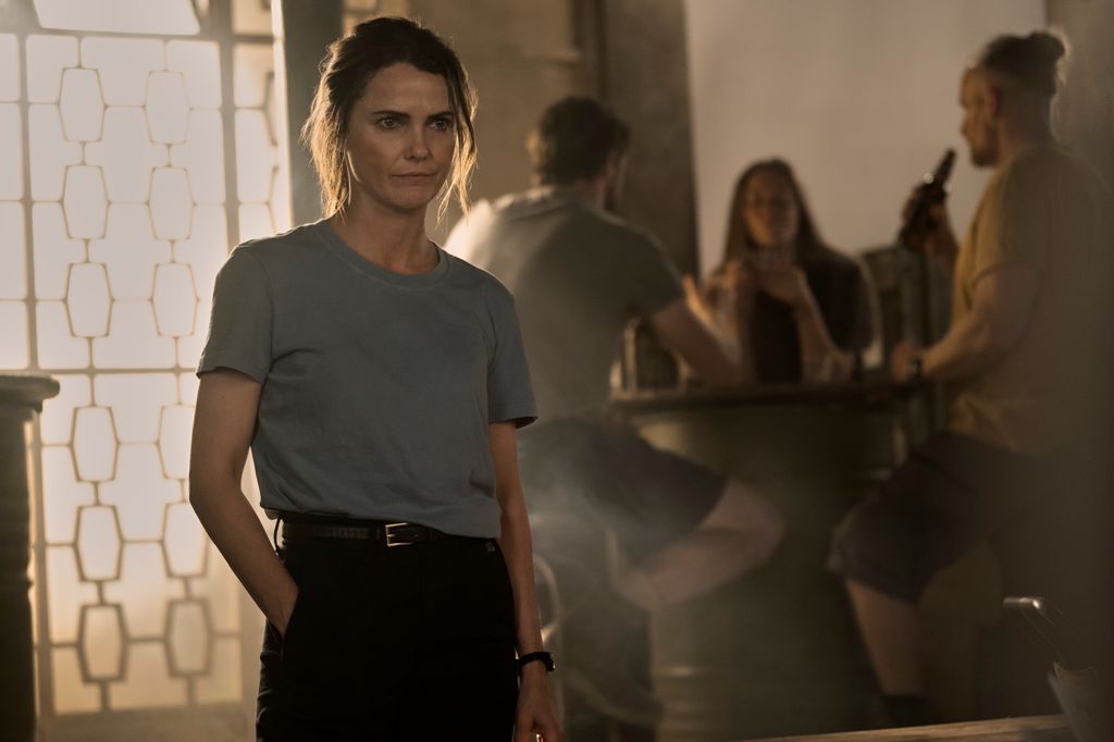 woman standing in dimly lit room