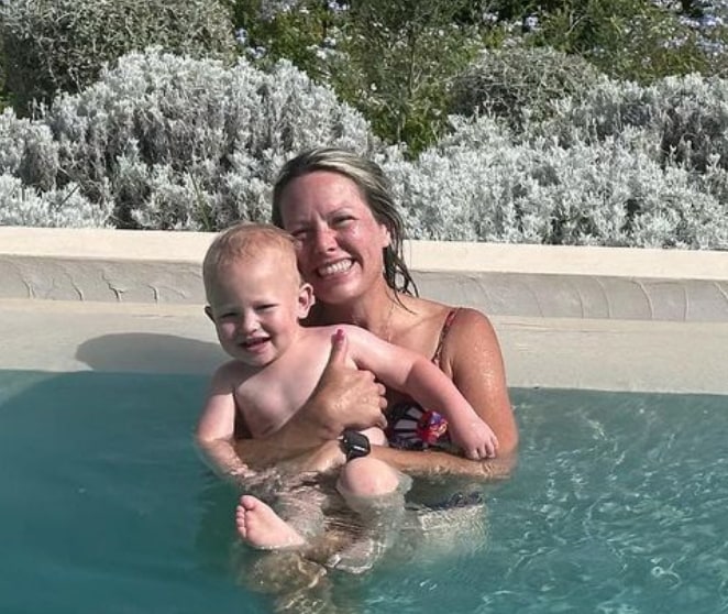 Photo shared by Dylan Dreyer on Instagram July 2023 where she appears in a pool with her youngest son Rusty during her vacation in Italy with her family.