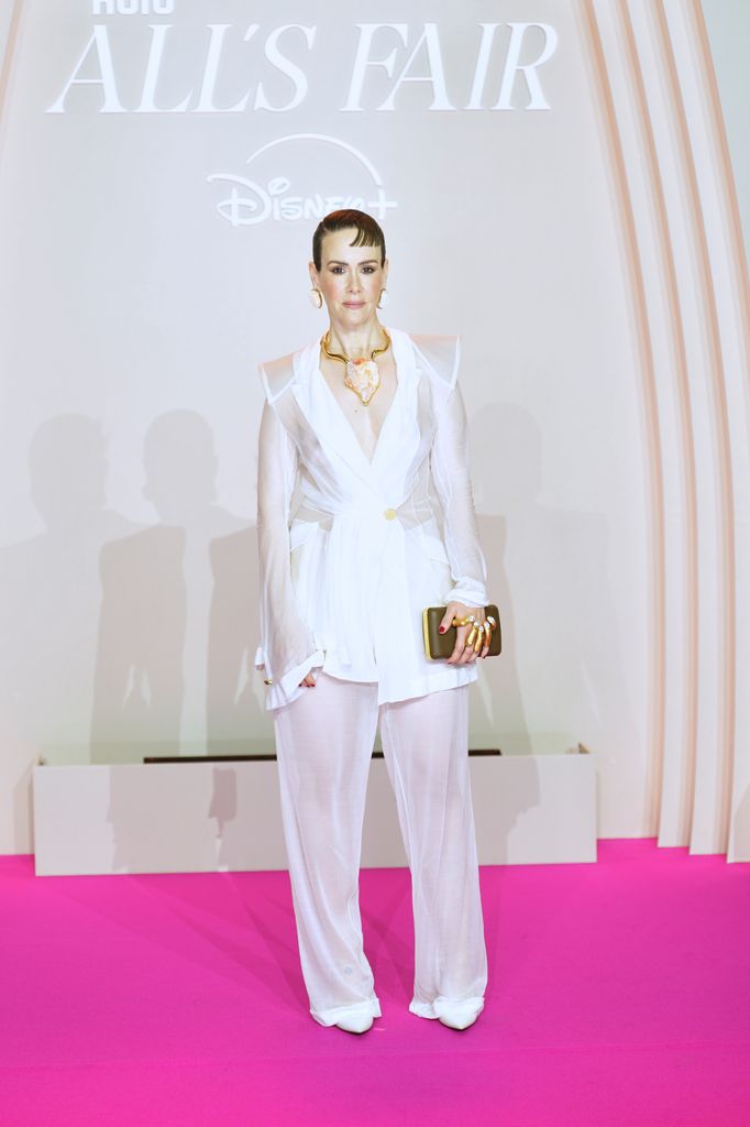 Sarah Paulson in sheer white suit at at the All's Fair Disney+ premiere at Maison de La Chimie