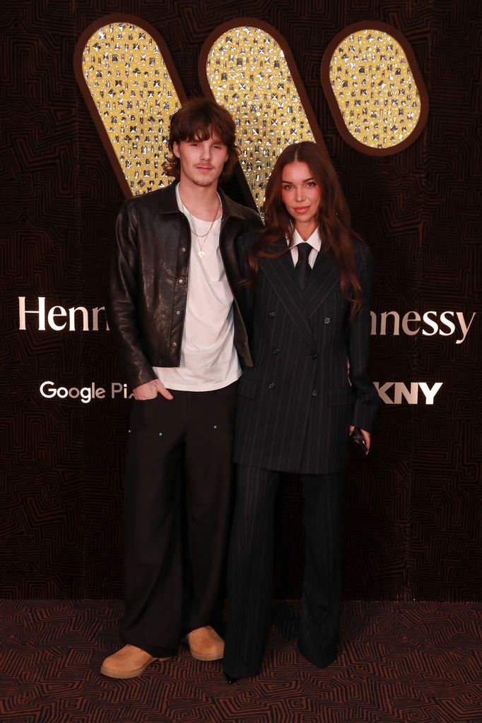 couple posing for photos at after party 