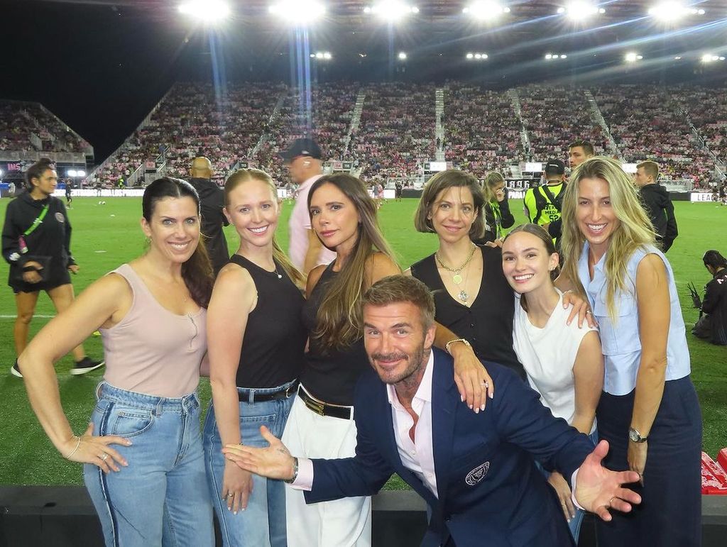 David Beckham poses with Victoria Beckham and her VBB team