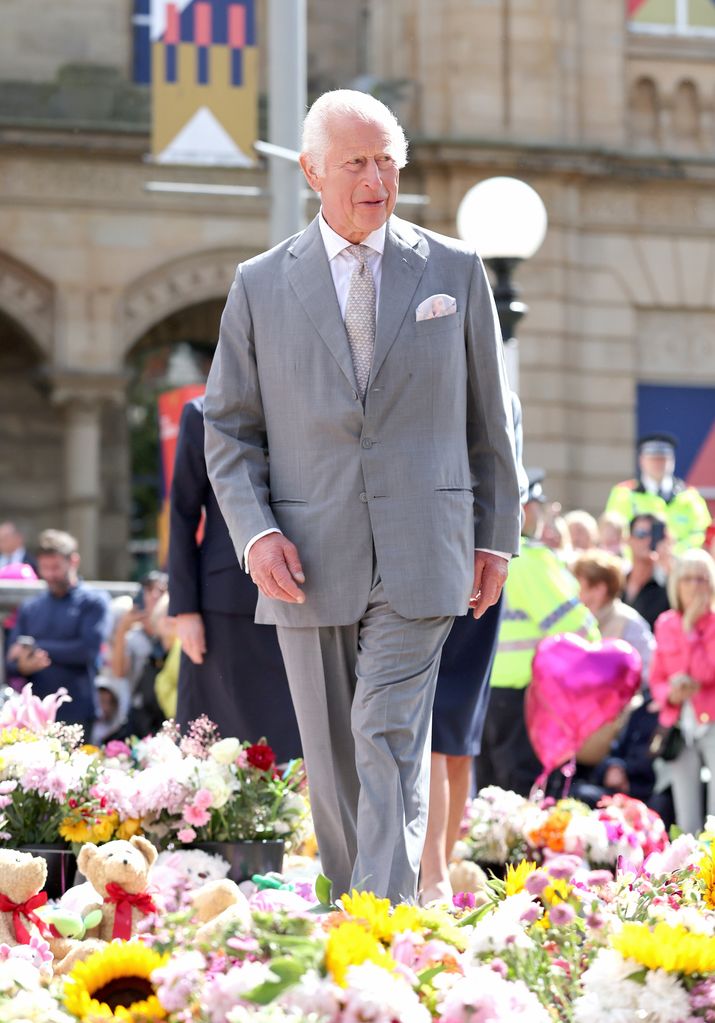 charles viewing floral tributes