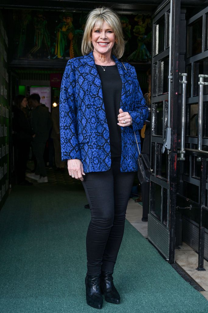 Ruth Langsford wearing black skinny jeans and a snake print blazer