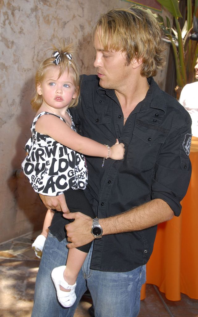 Dannielynn Smith (Anna Nicole Smith's daughter) and Larry Birkhead arrive at the Launch celebration party for The Simpson's Ride at Universal Studios Hollywood on May 17, 2008 in Universal City, California