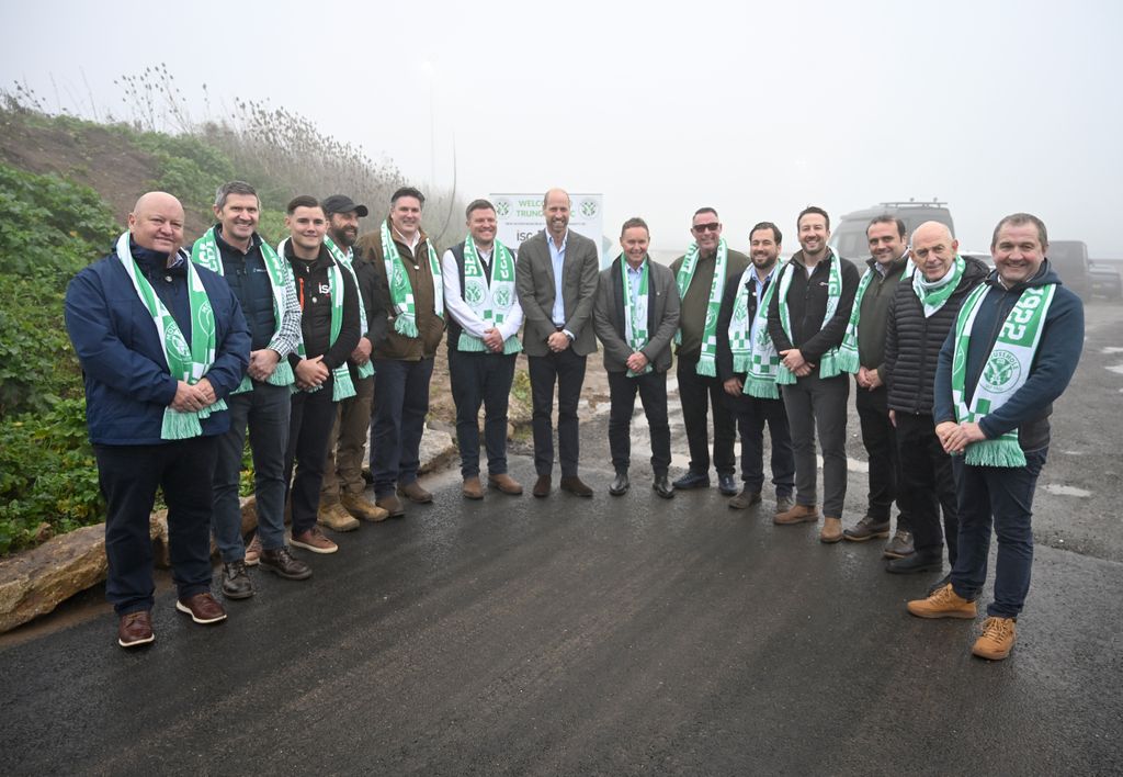 William poses with members of the consortium who built the new road