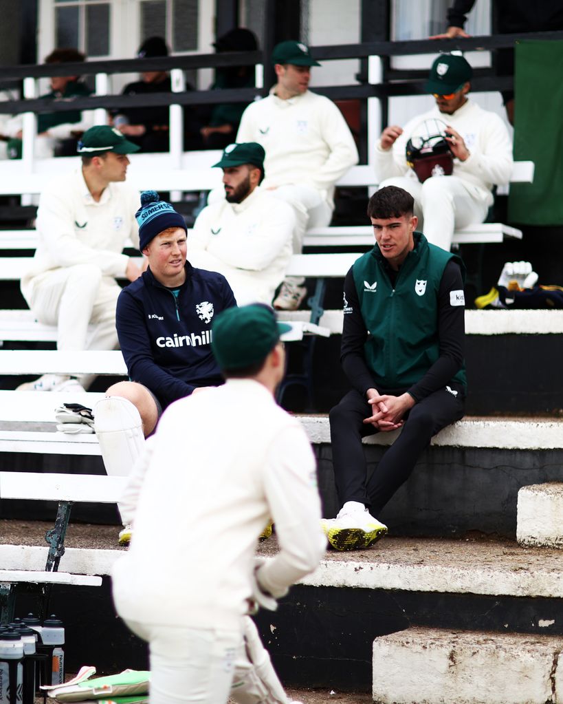 Josh Baker sat with members of his cricket club