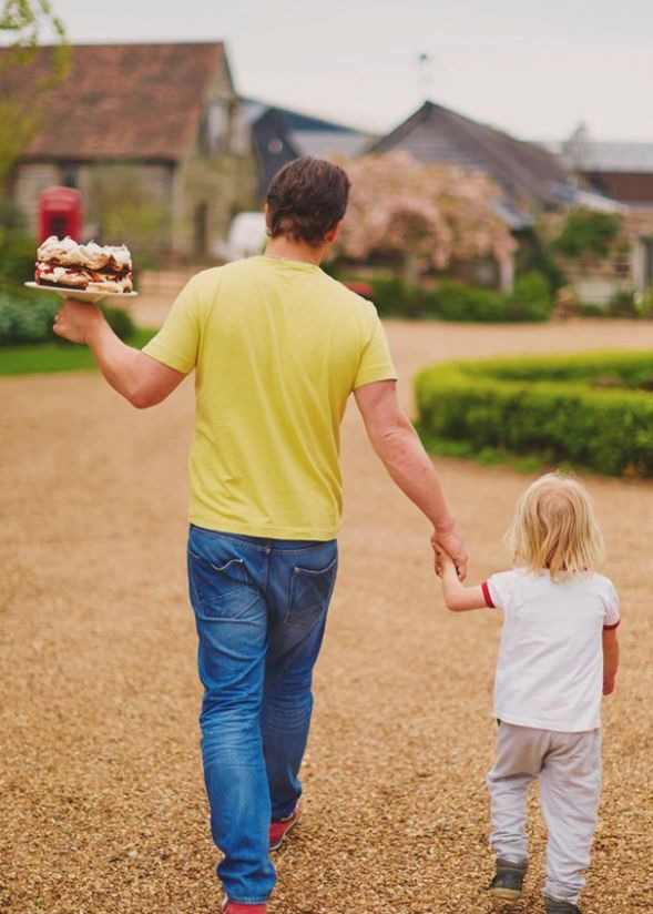 Jamie Oliver walking with a young Buddy