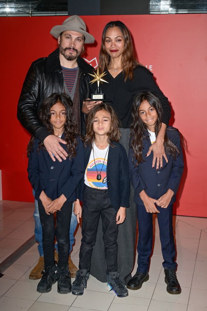 Zoe Saldana makes rare red carpet appearance with her three lookalike sons and husband Marco Perego