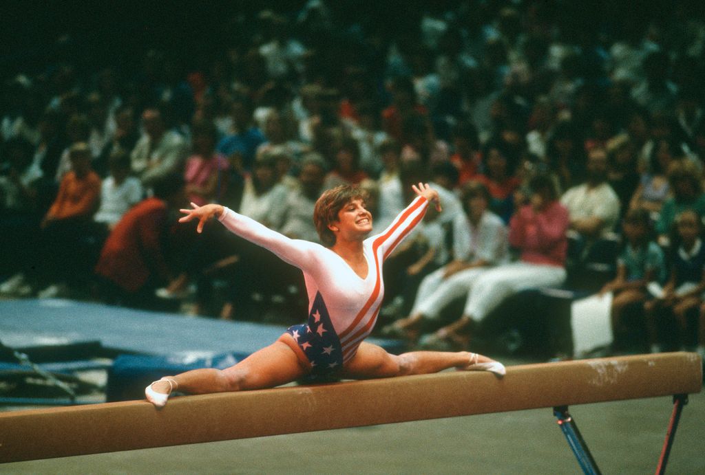 Gymnast Mary Lou Retton of the United States competes in the balance beam competition in gymnastics during the Games of the XXIII Olympiad in the 1984 Summer Olympics circa 1984 at UCLA's Pauley Pavilion in Los Angeles, California.